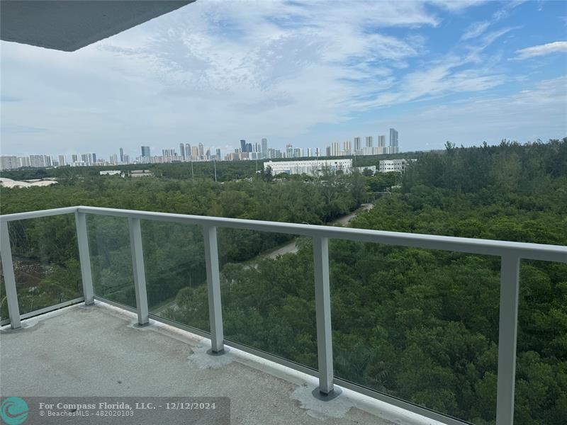 a view of a balcony with an outdoor space