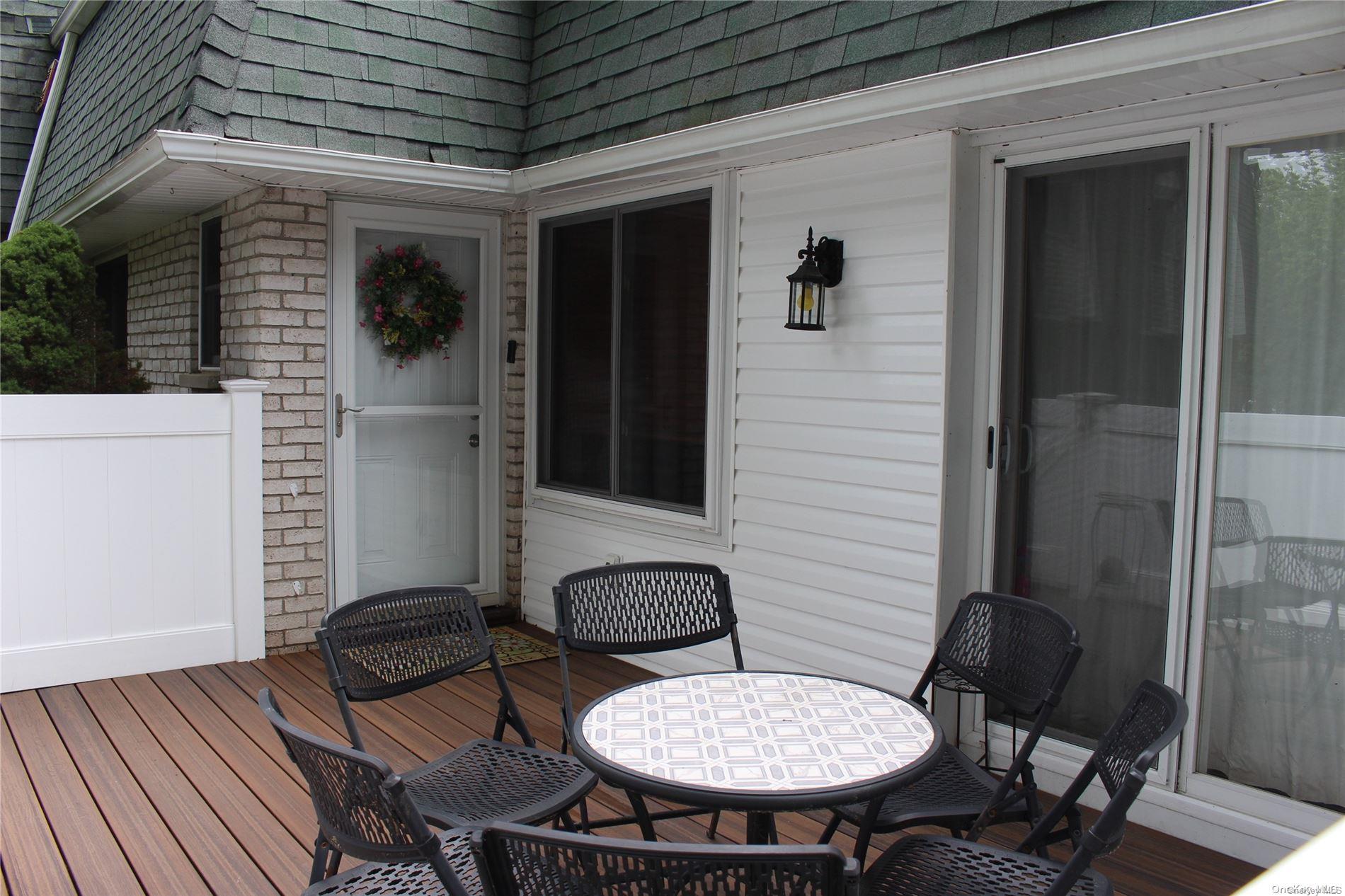 a view of a porch with seating space