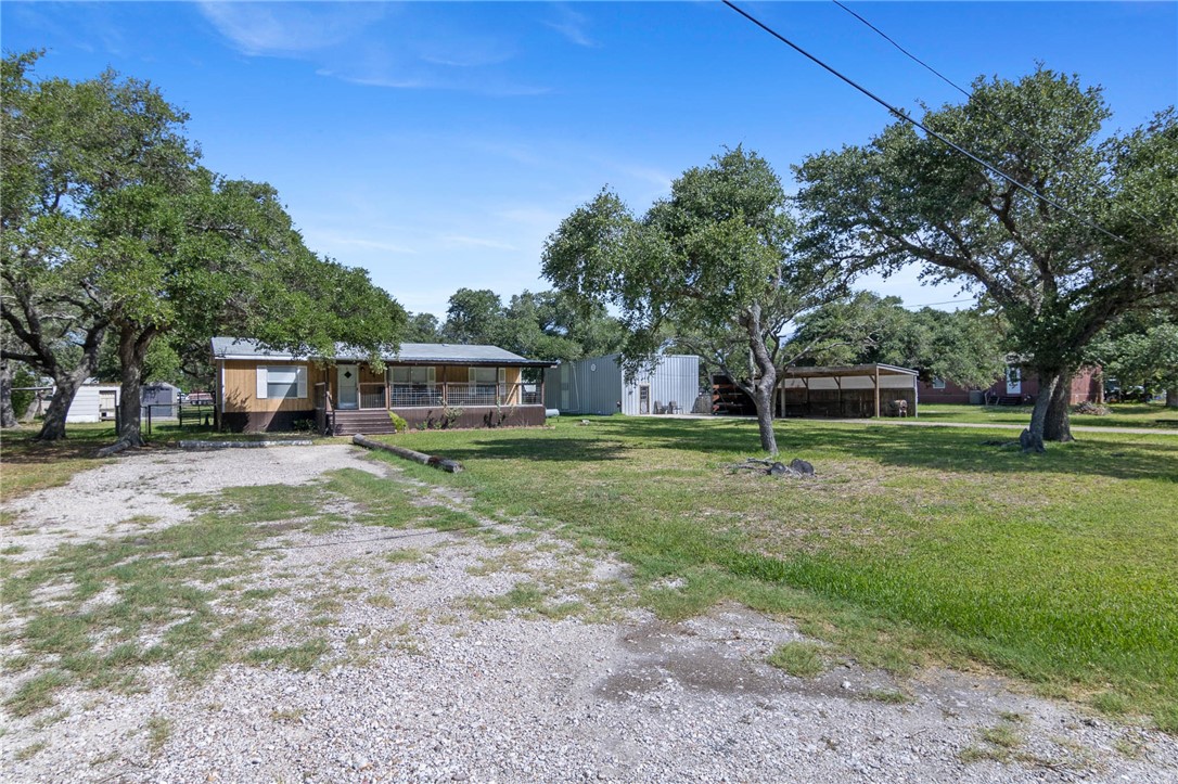 a view of a house with a big yard