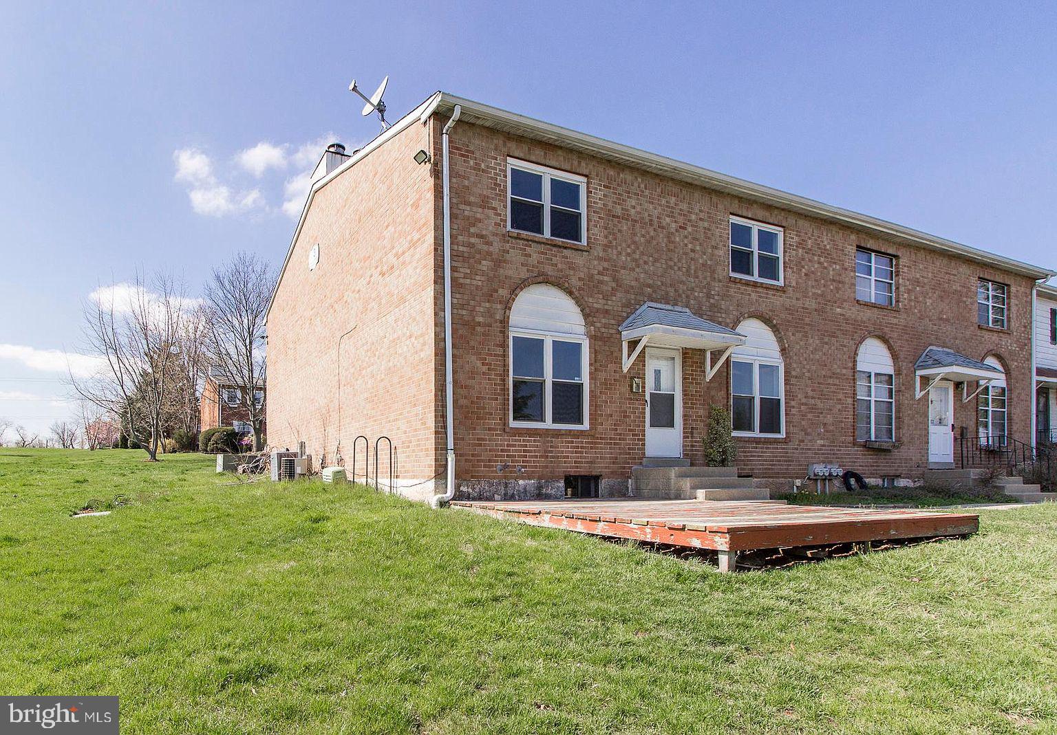 a front view of house with a yard