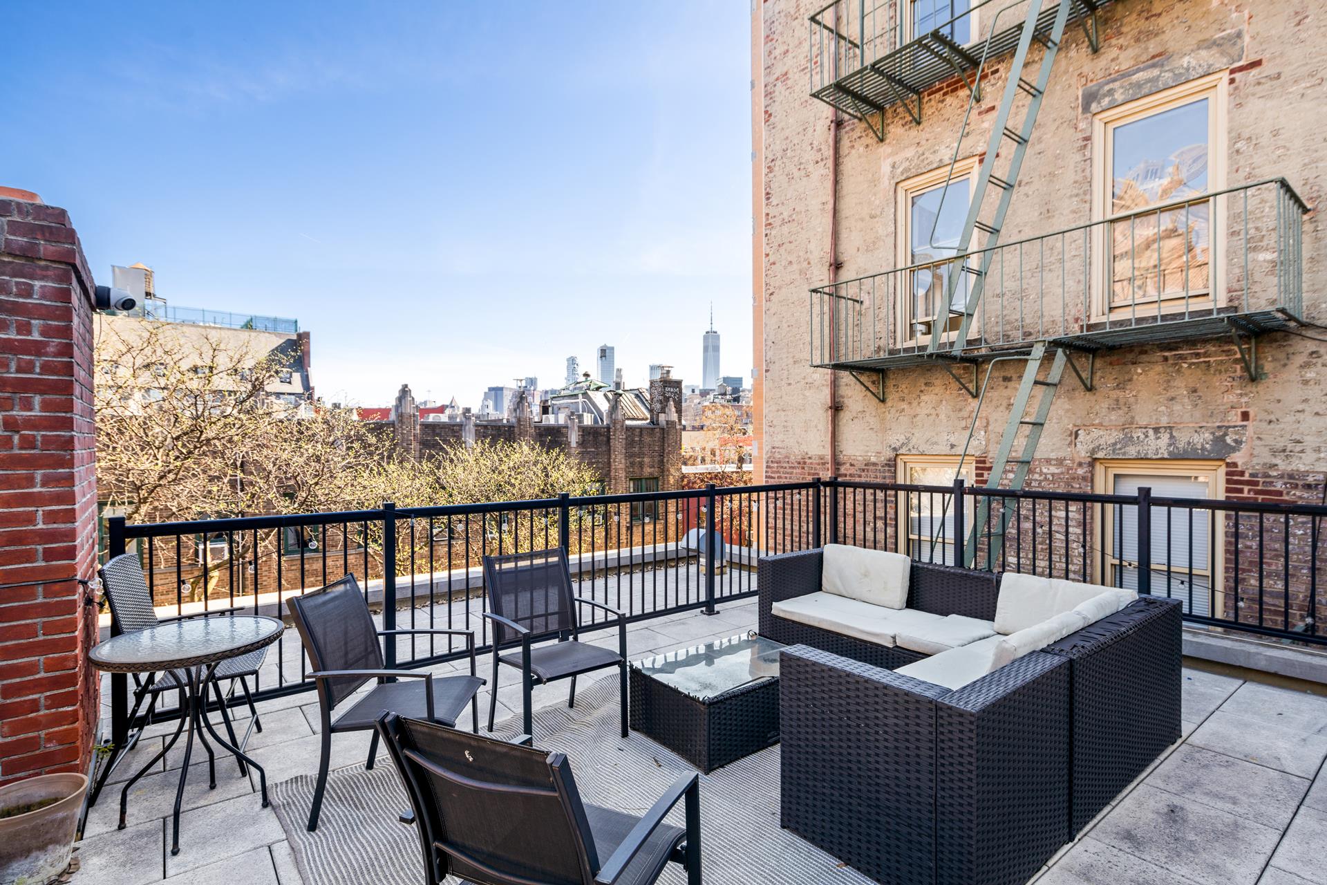 a view of a chairs on the roof deck