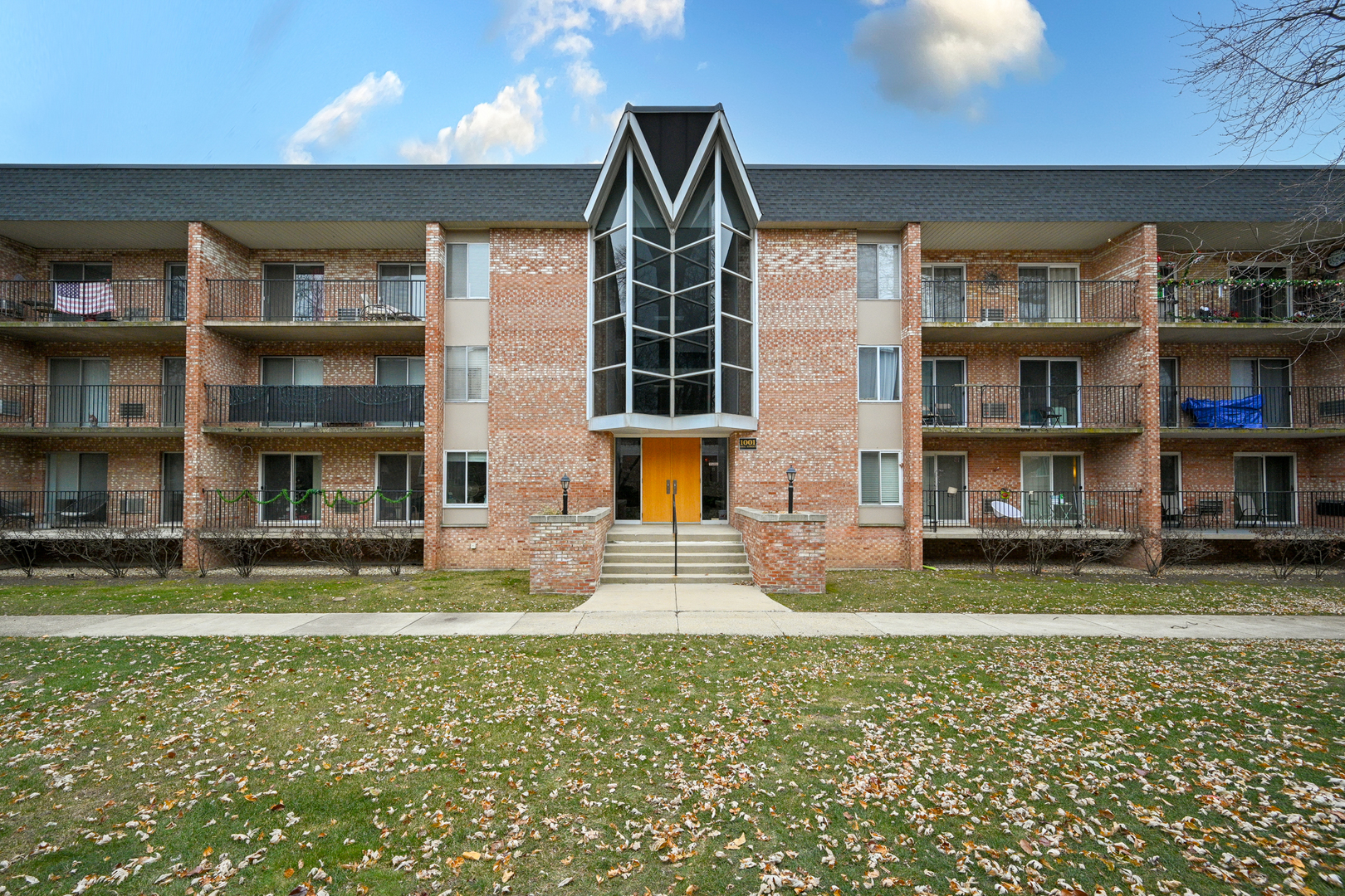 a front view of building with yard