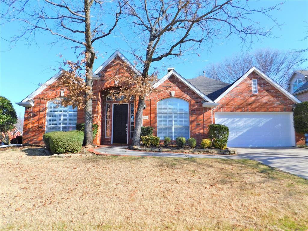 front view of a house with a small yard