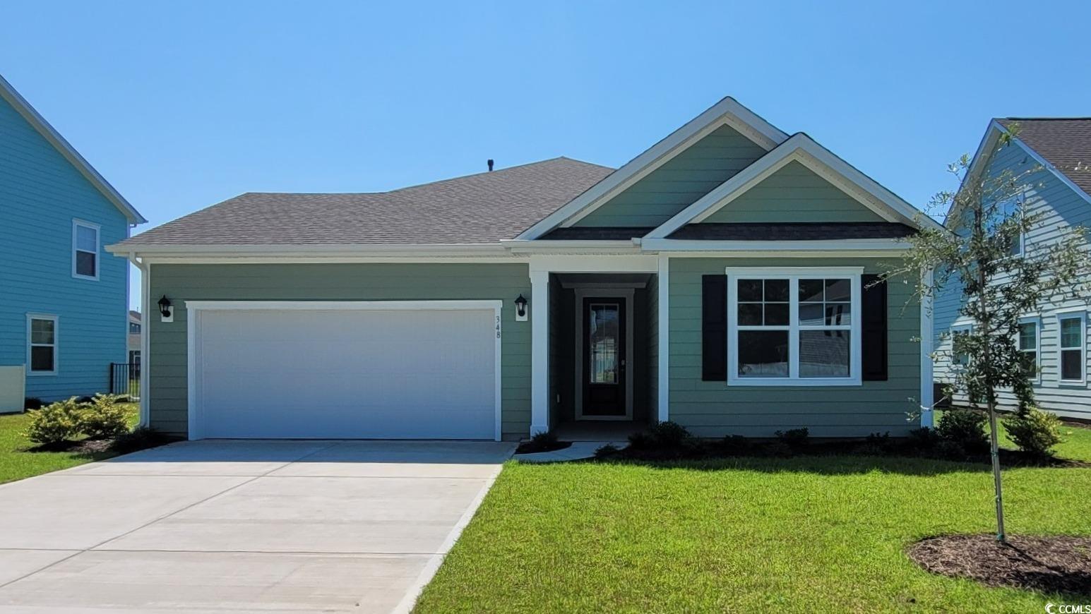 View of front of property featuring a front lawn a