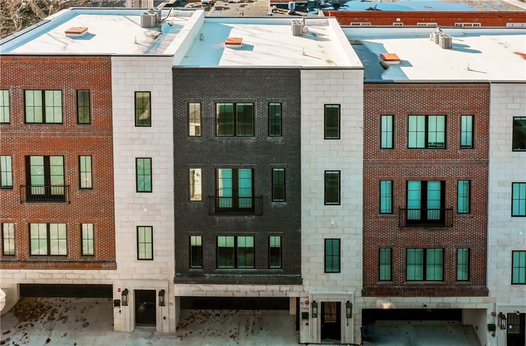 a view of a brick building with many windows