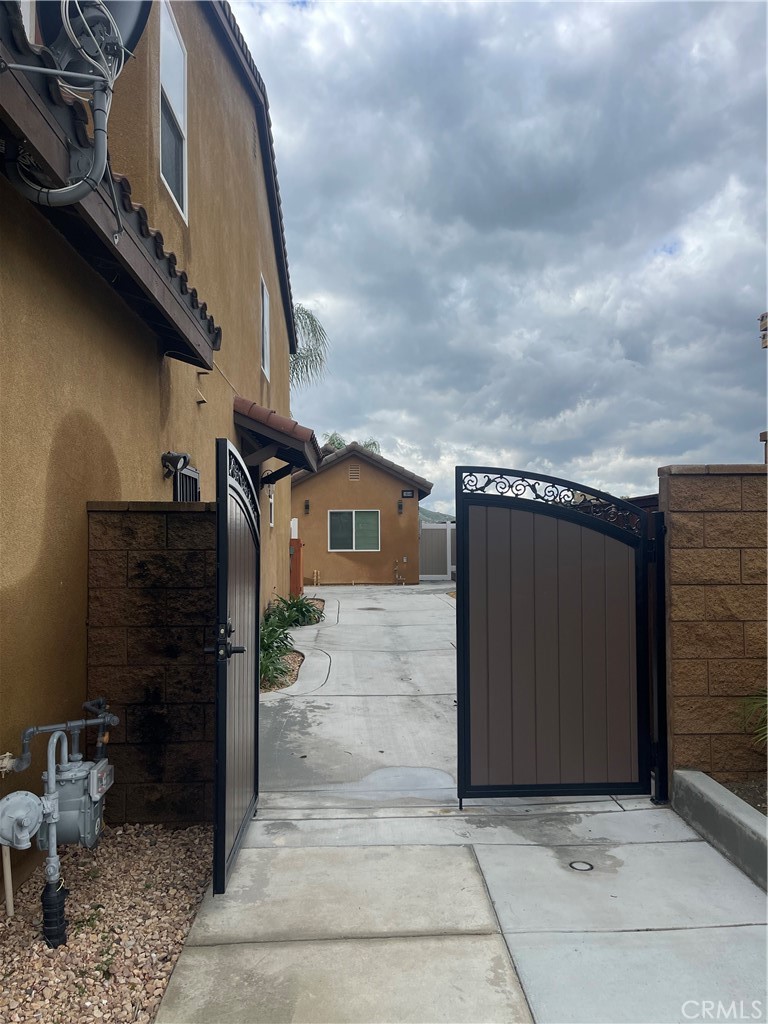 a view of a street with an empty space and a garage