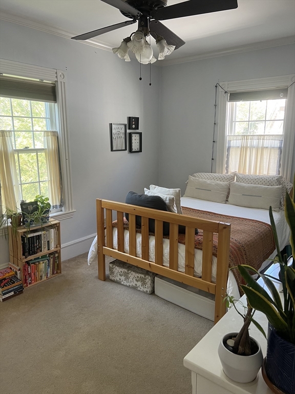 a bedroom with furniture and a window