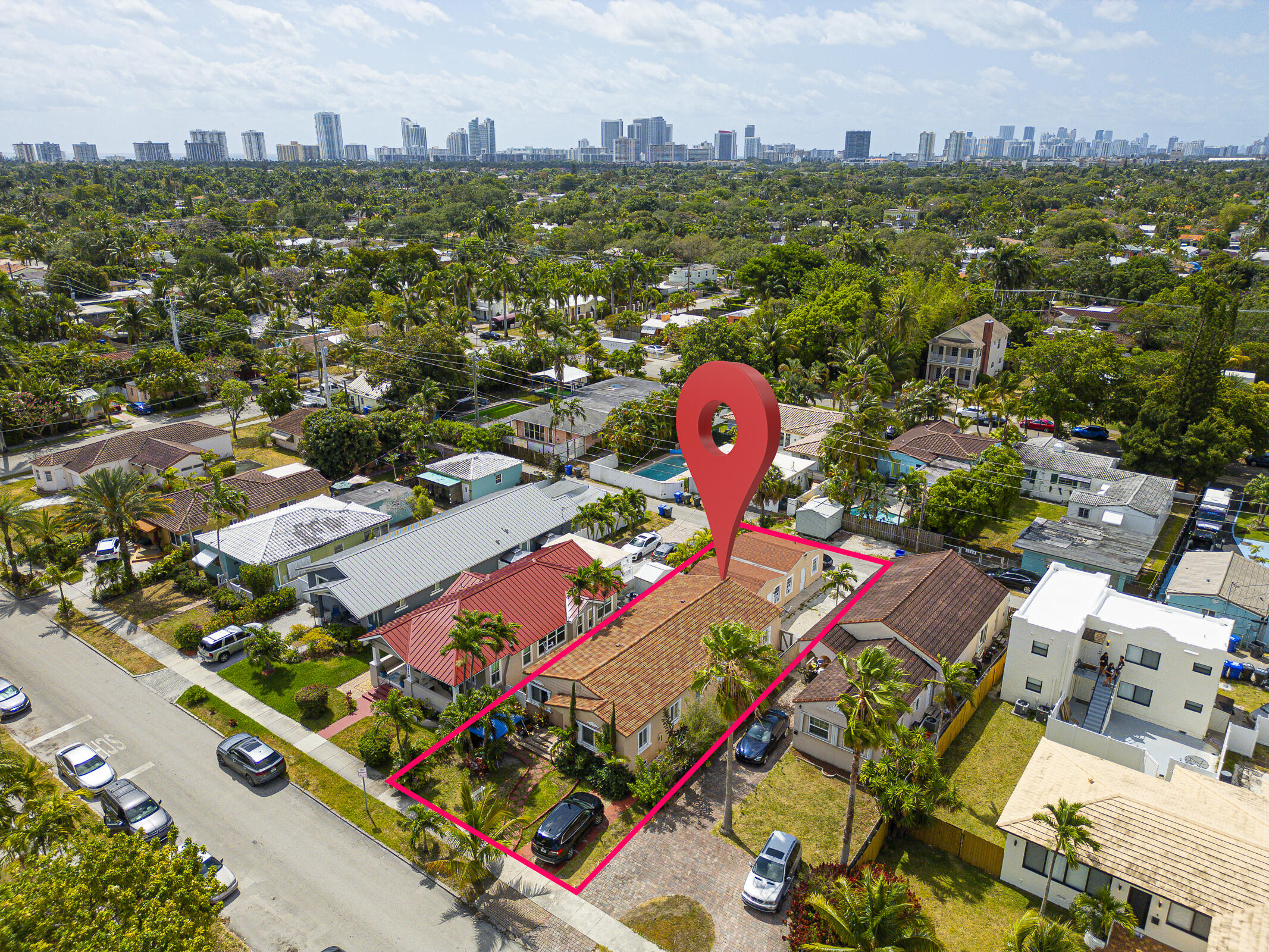 an aerial view of multiple houses with yard