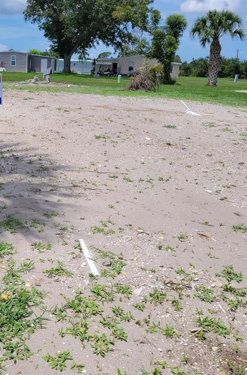 a view of a dirt with a yard