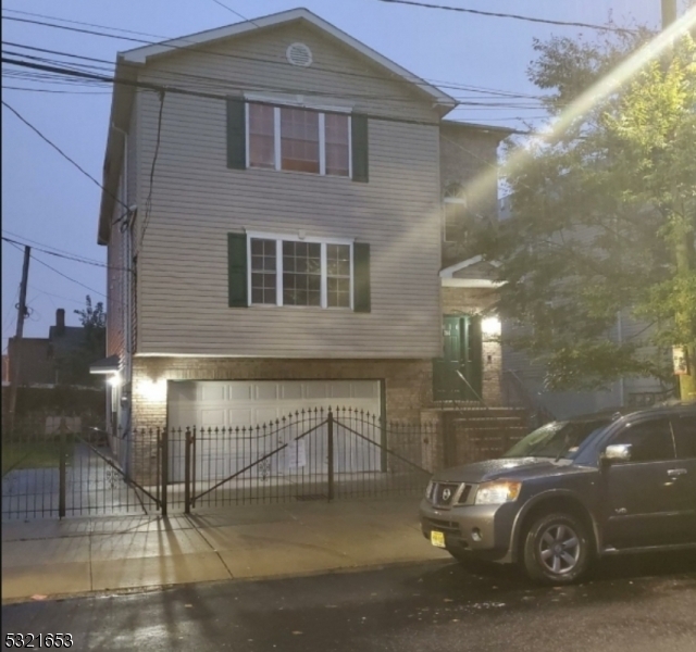 a front view of a house with parking