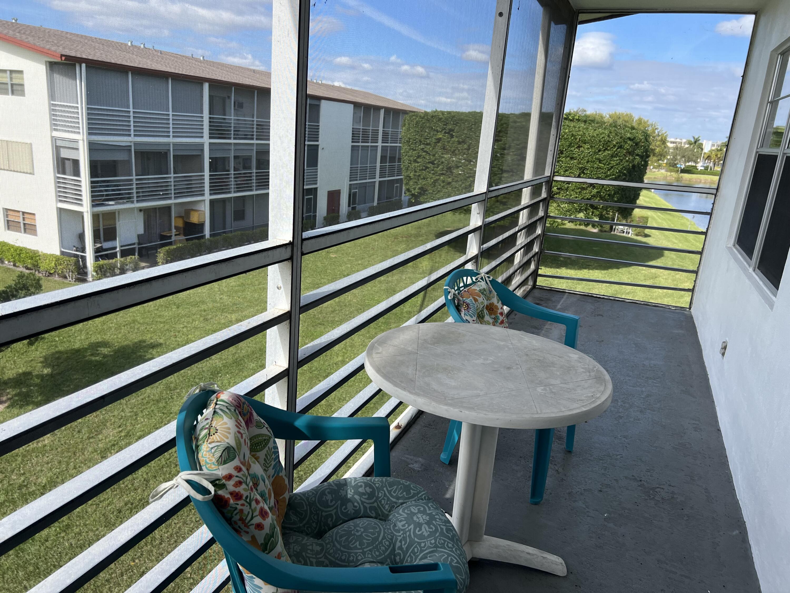 a view of a balcony with chairs