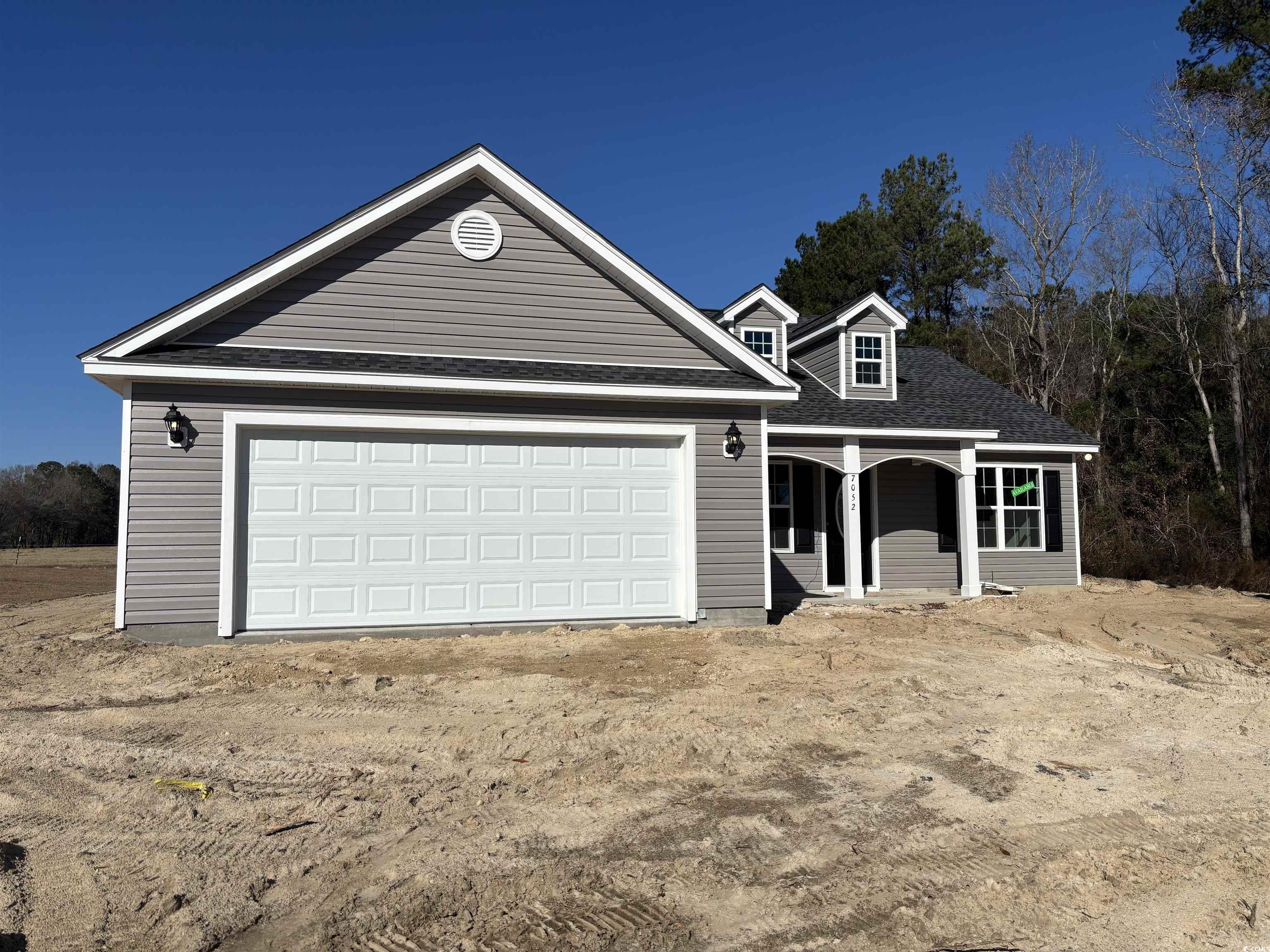 View of front of property featuring a garage