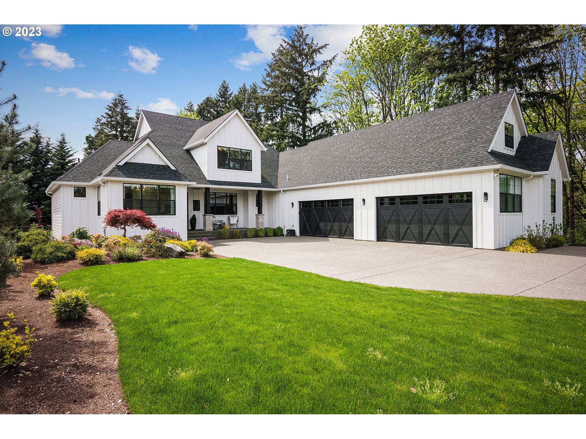 a front view of house with yard and green space