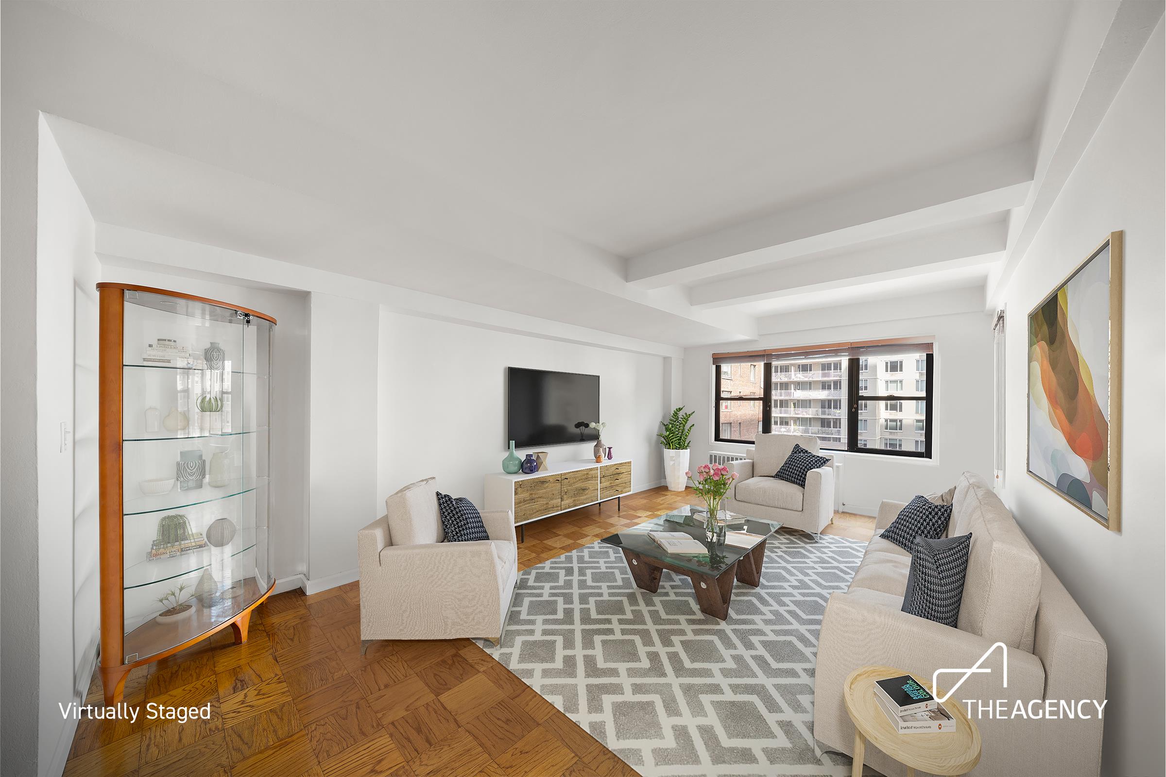 a living room with furniture wooden floor and a flat screen tv