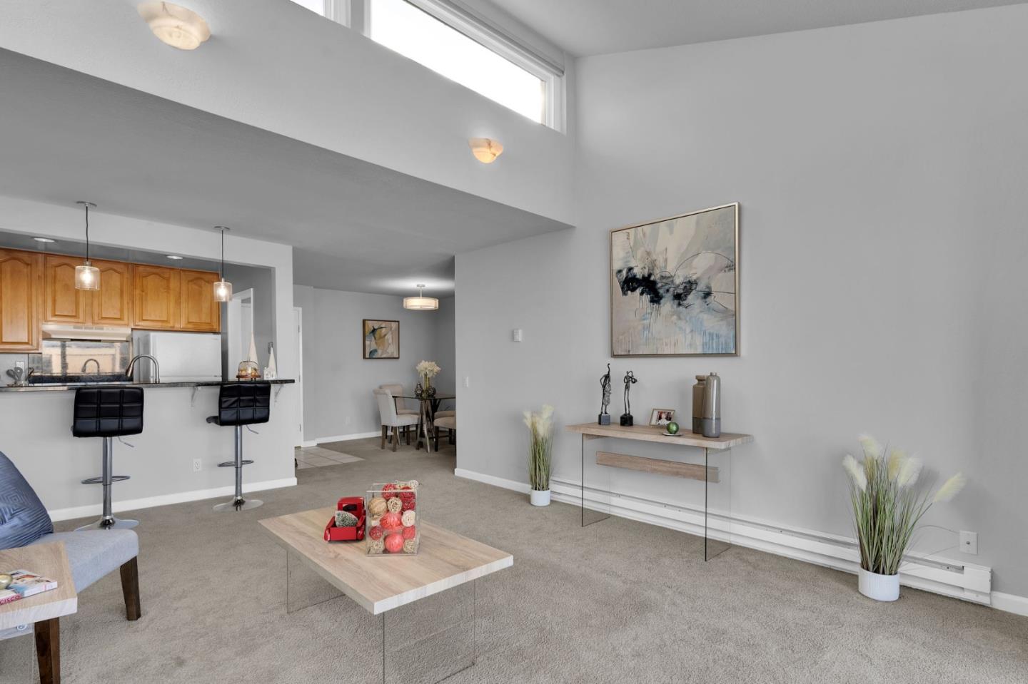 a living room with furniture and white walls