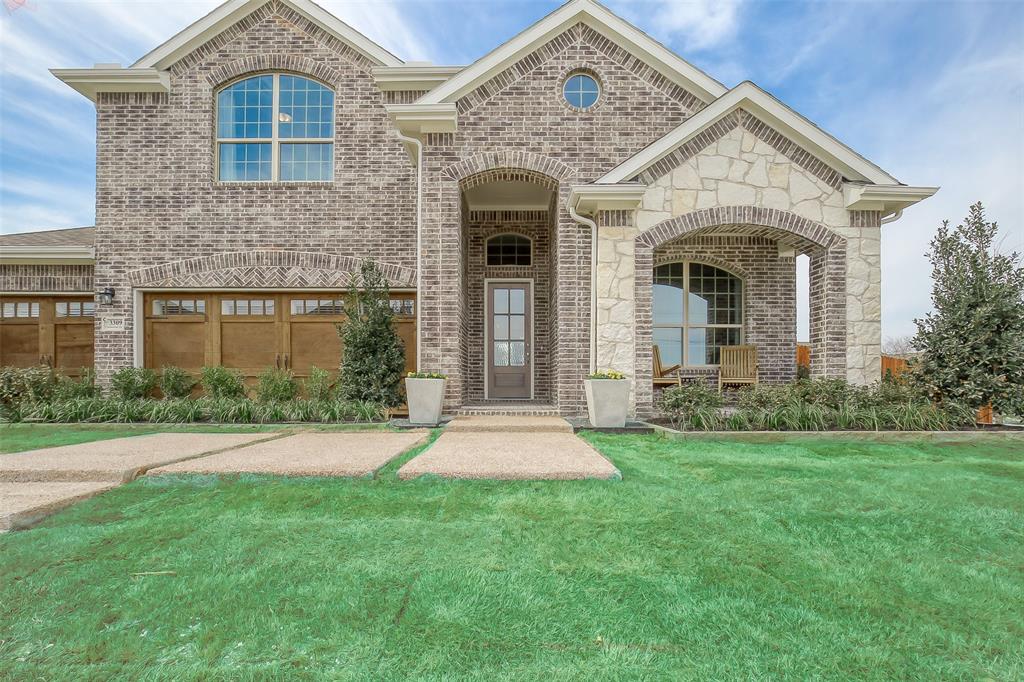 front view of a house with a yard