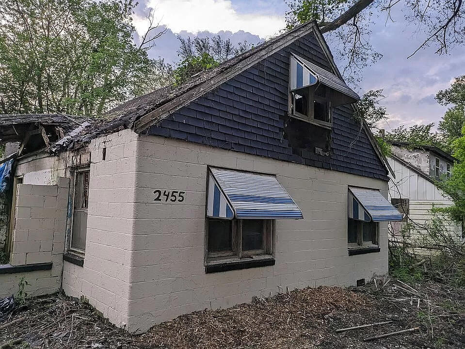 a front view of a house with garden