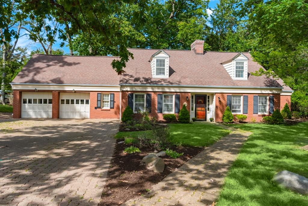 front view of a house with a garden