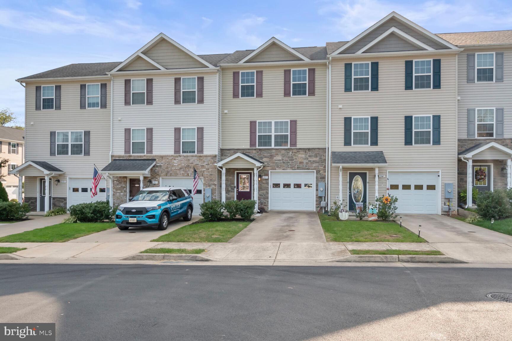 a view of multiple houses with a yard