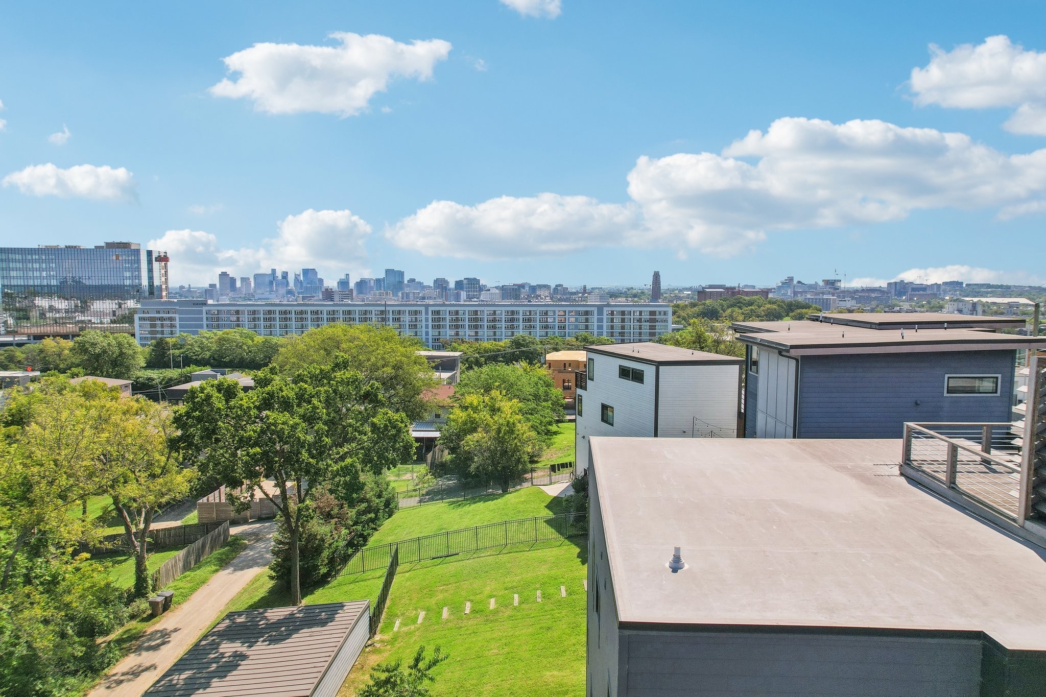 a terrace with outdoor seating and city view