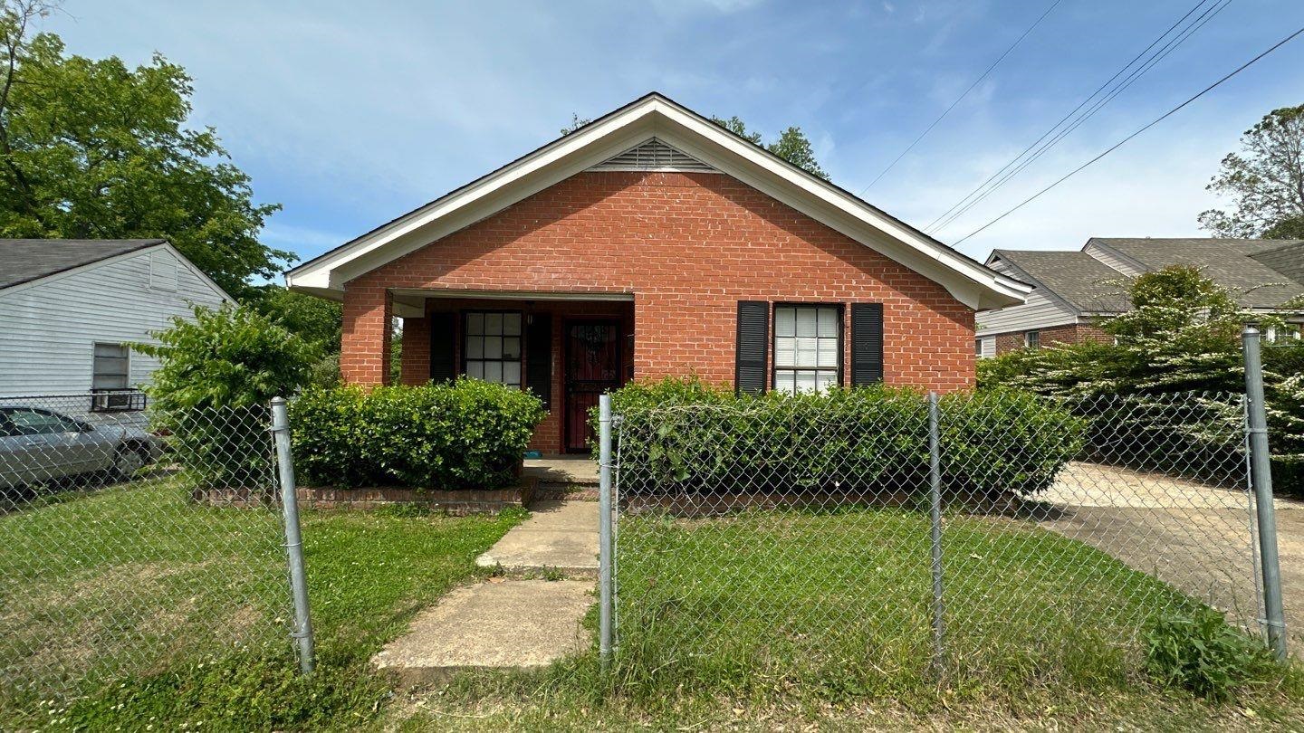 Bungalow-style house featuring a front lawn