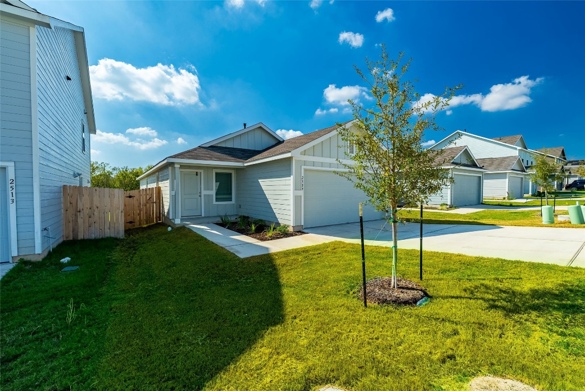 a swimming pool with yard in front of it