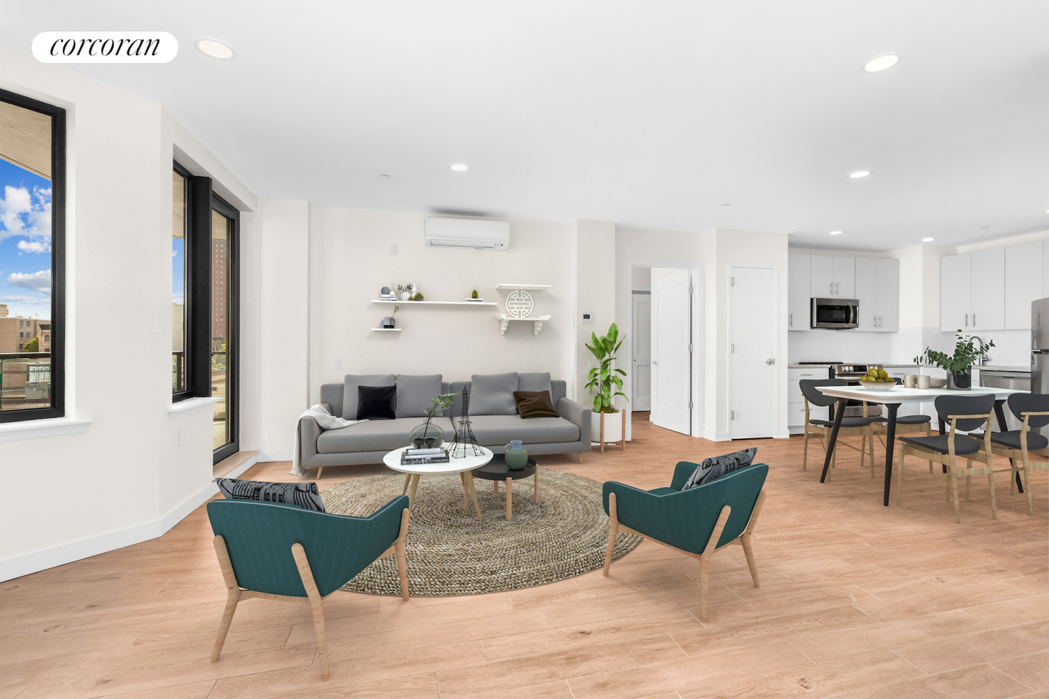 a living room with furniture kitchen view and a large window