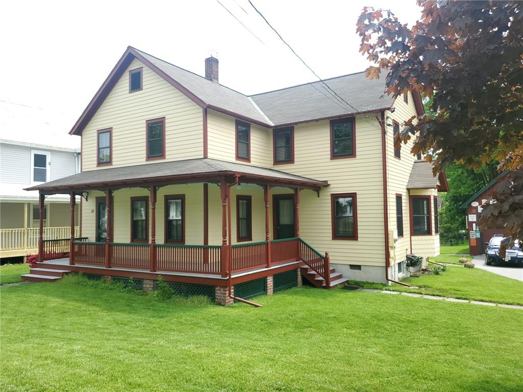 wrap around rocking chair porch with two entry doors