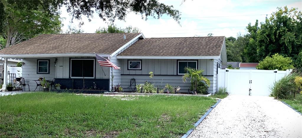 a front view of house with yard and green space