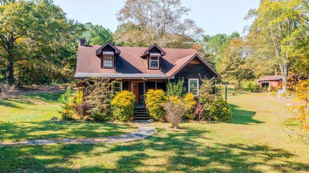 a front view of a house with garden