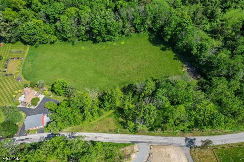 an aerial view of a golf course with a garden