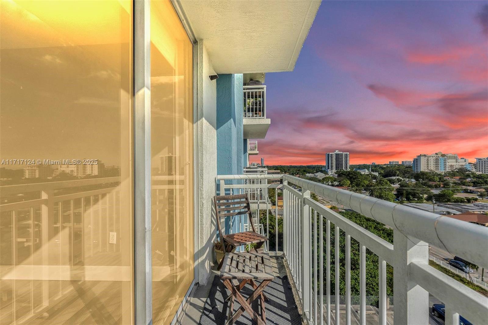 a view of a balcony with city view