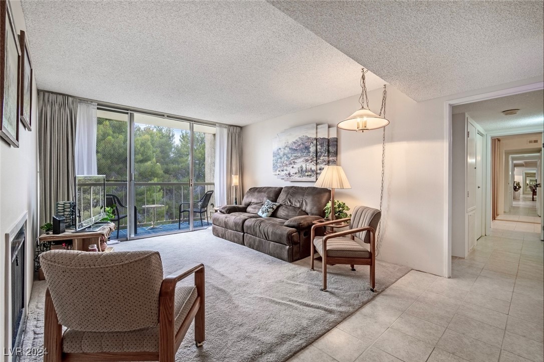 Living Room with Private Balcony & Fireplace