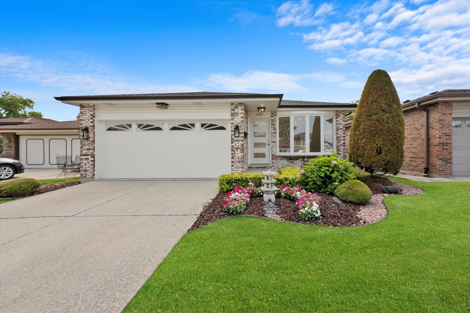 a front view of a house with garden