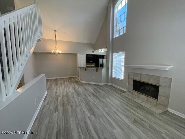 wooden floor in an empty room with a fireplace