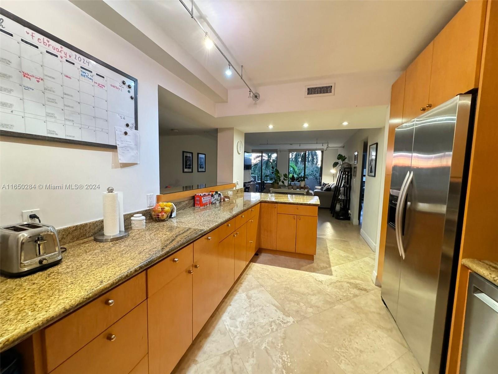 a large bathroom with a tub and sink