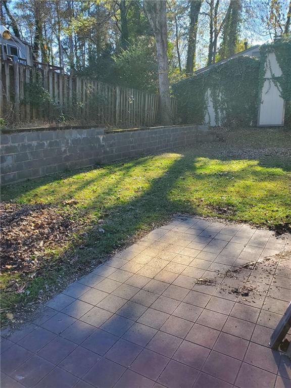 a view of a backyard with swimming pool