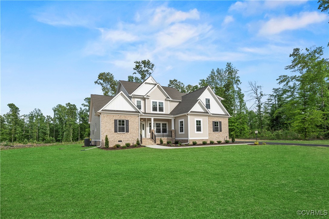 a front view of a house with a garden and trees