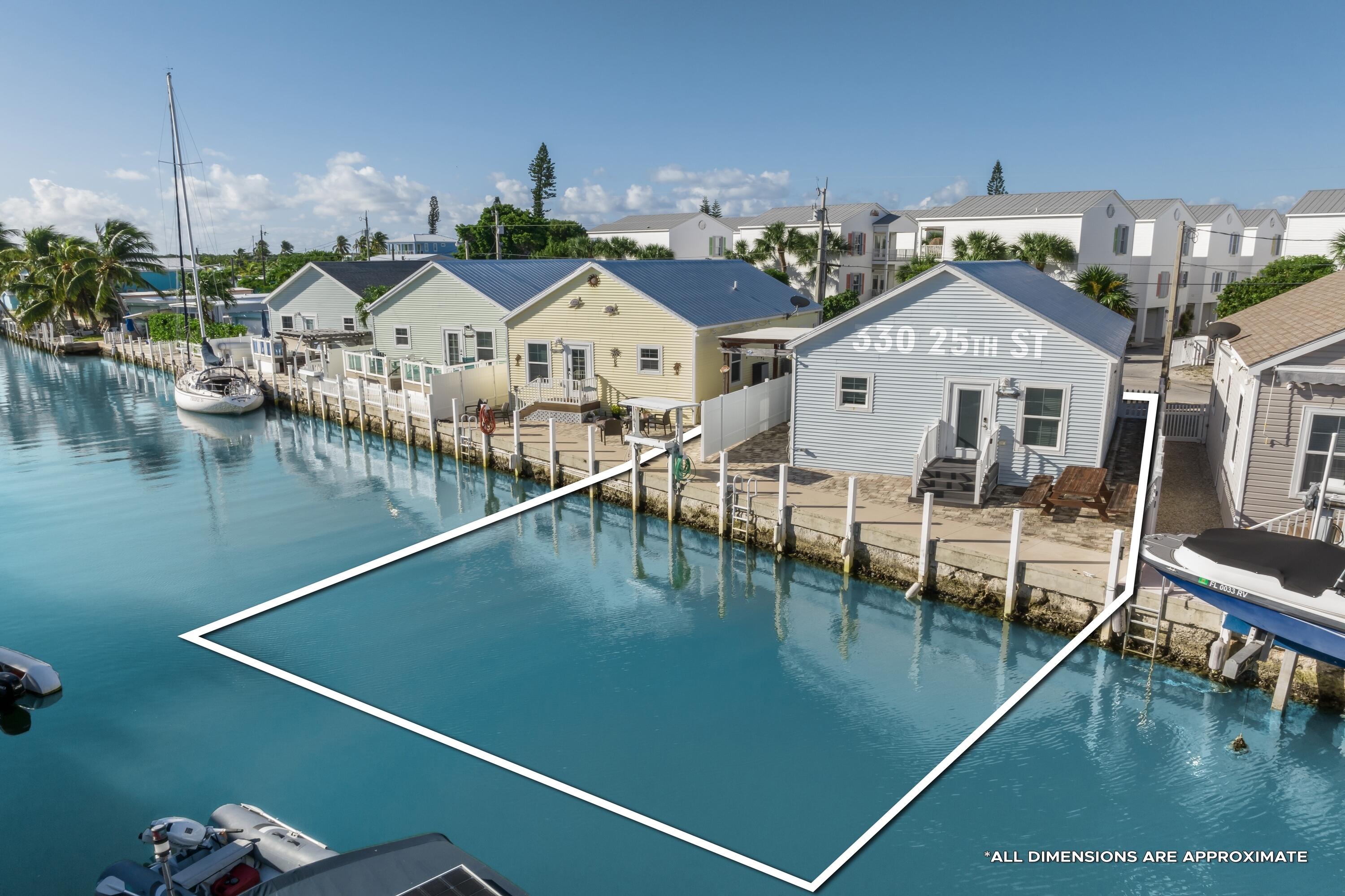 a view of a house with pool and chairs