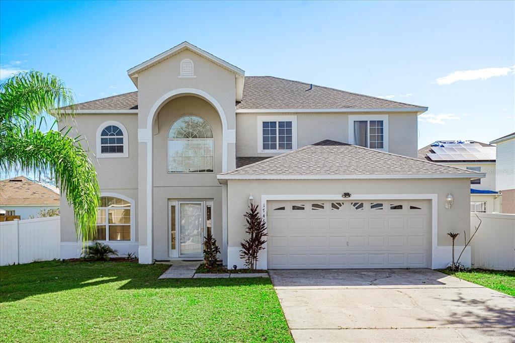 a view of a house with a yard