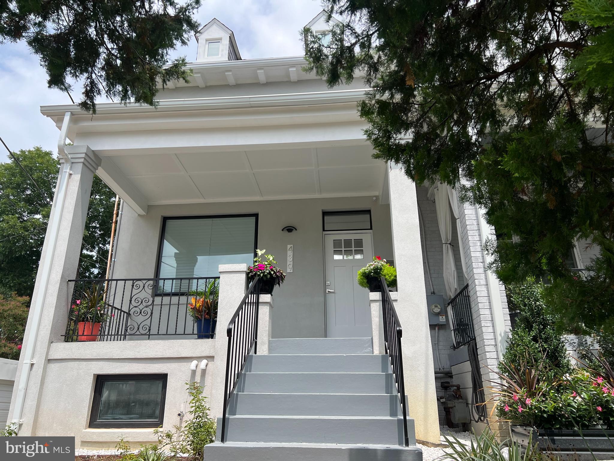 a view of house with outdoor space and entryway