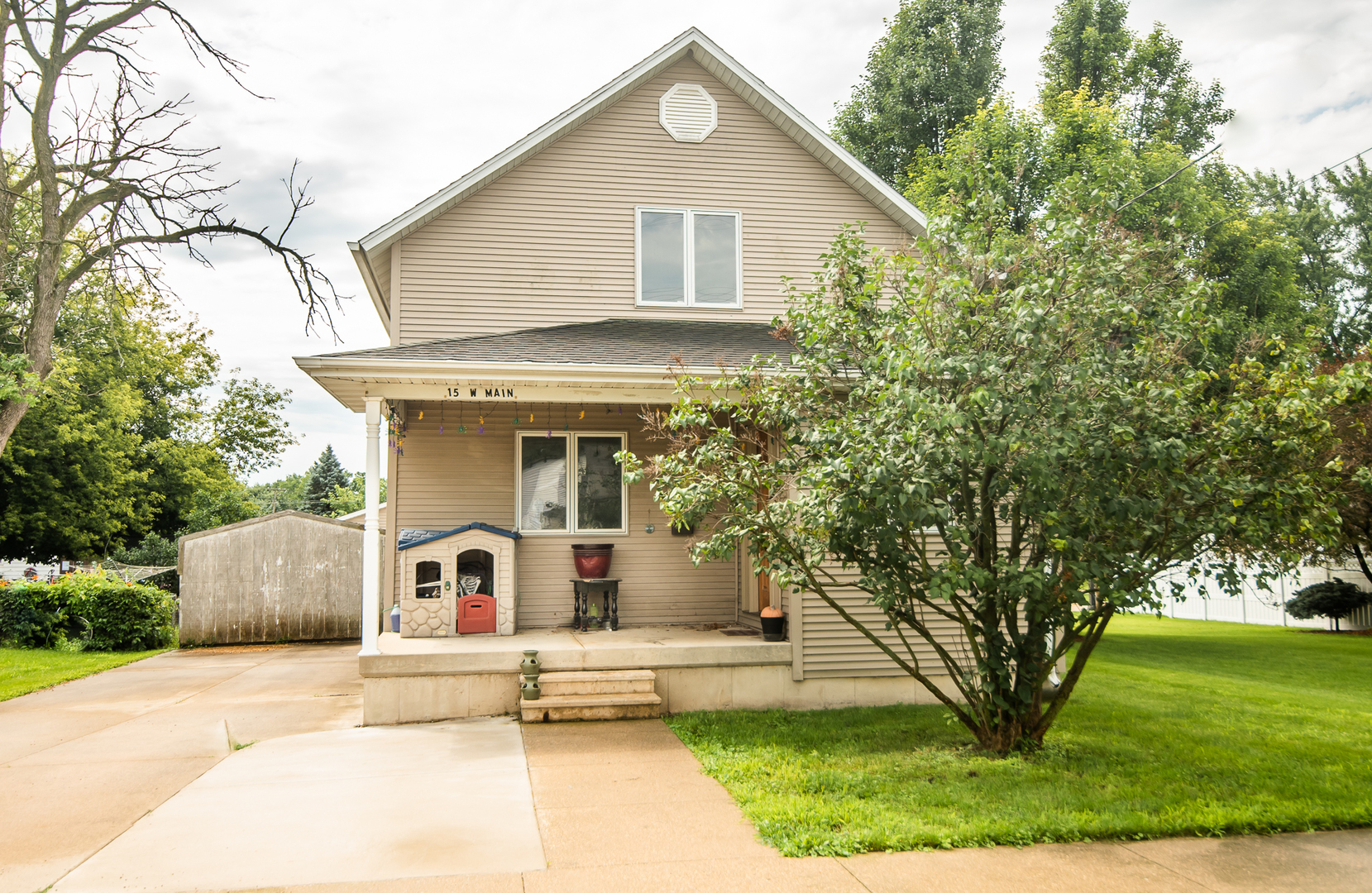 a front view of a house with garden