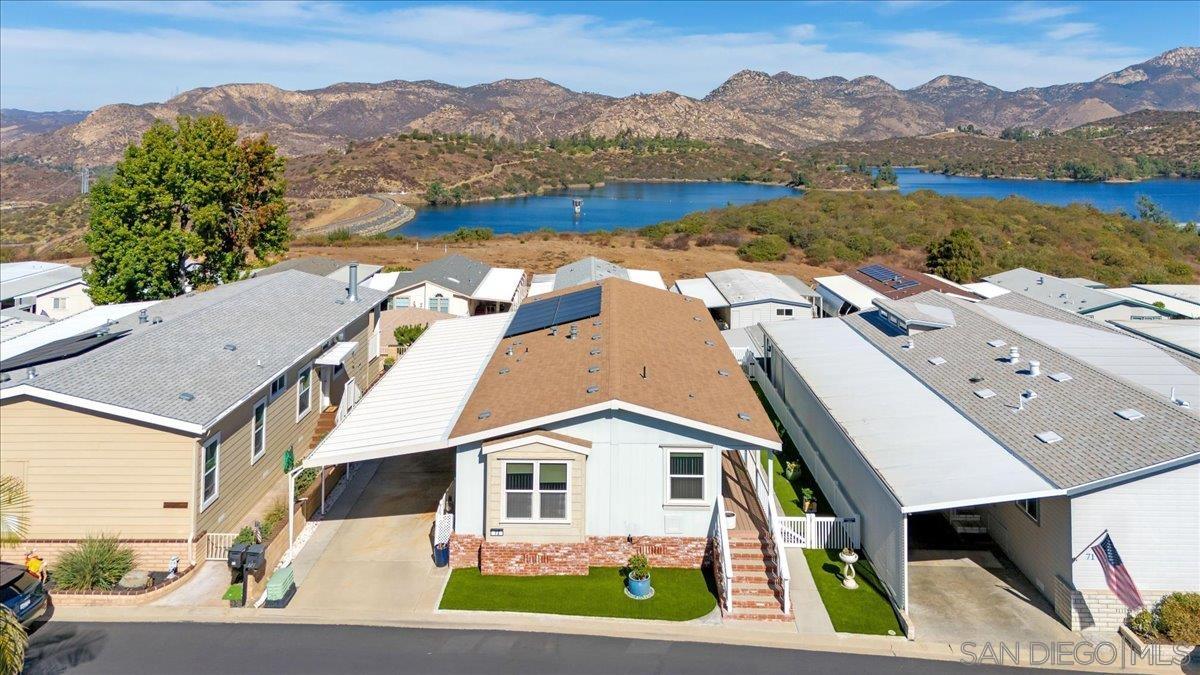 an aerial view of house with lake view