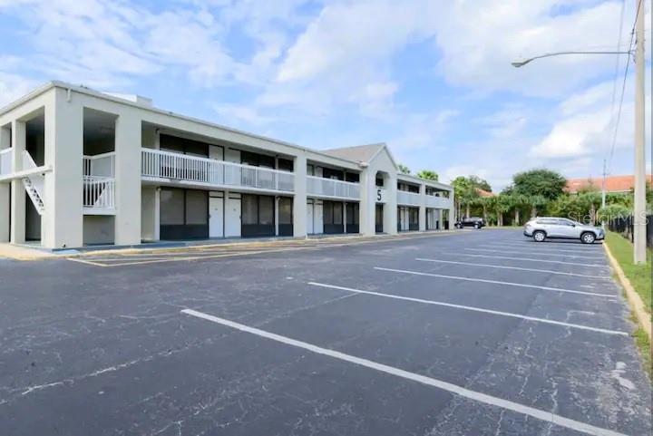 a couple of cars parked in front of building