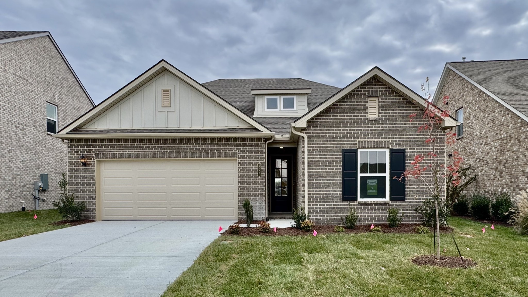 a front view of a house with a yard