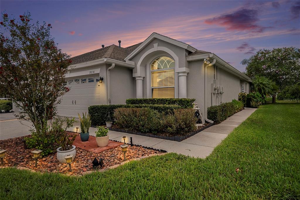 a front view of a house with a yard