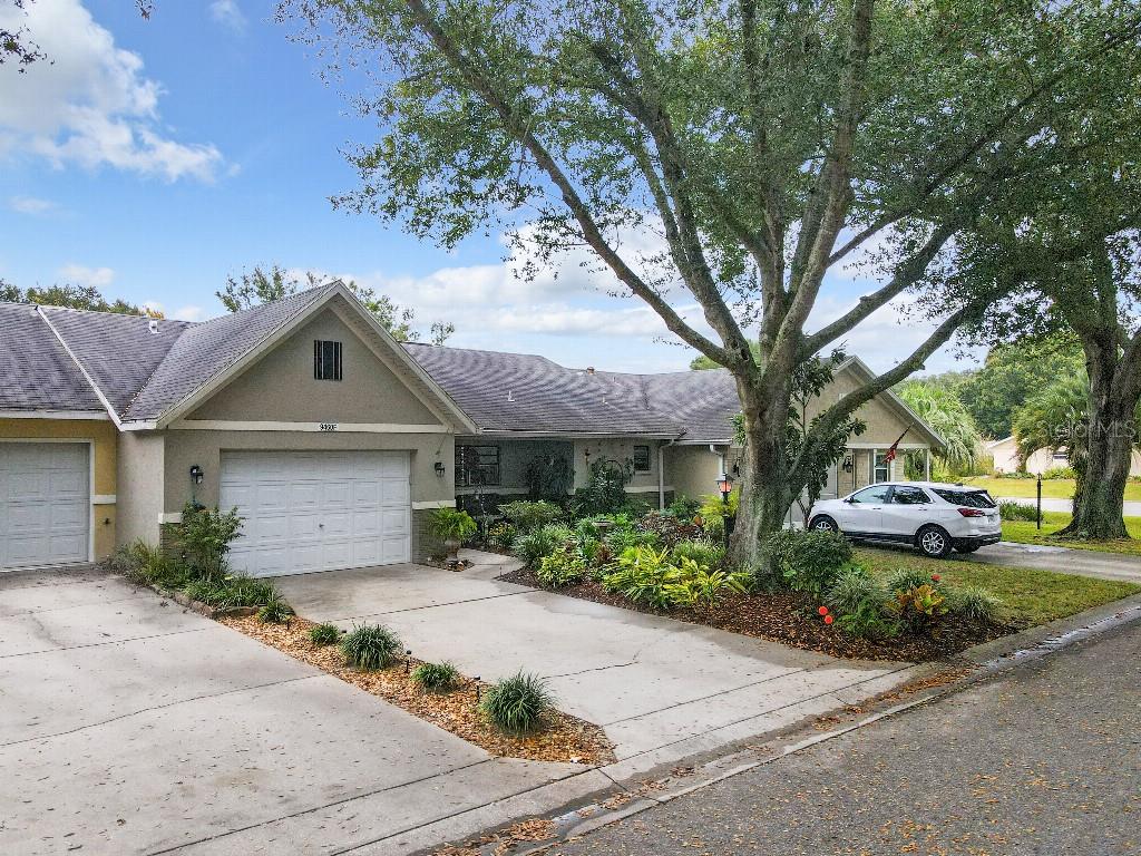 front view of a house with a garden