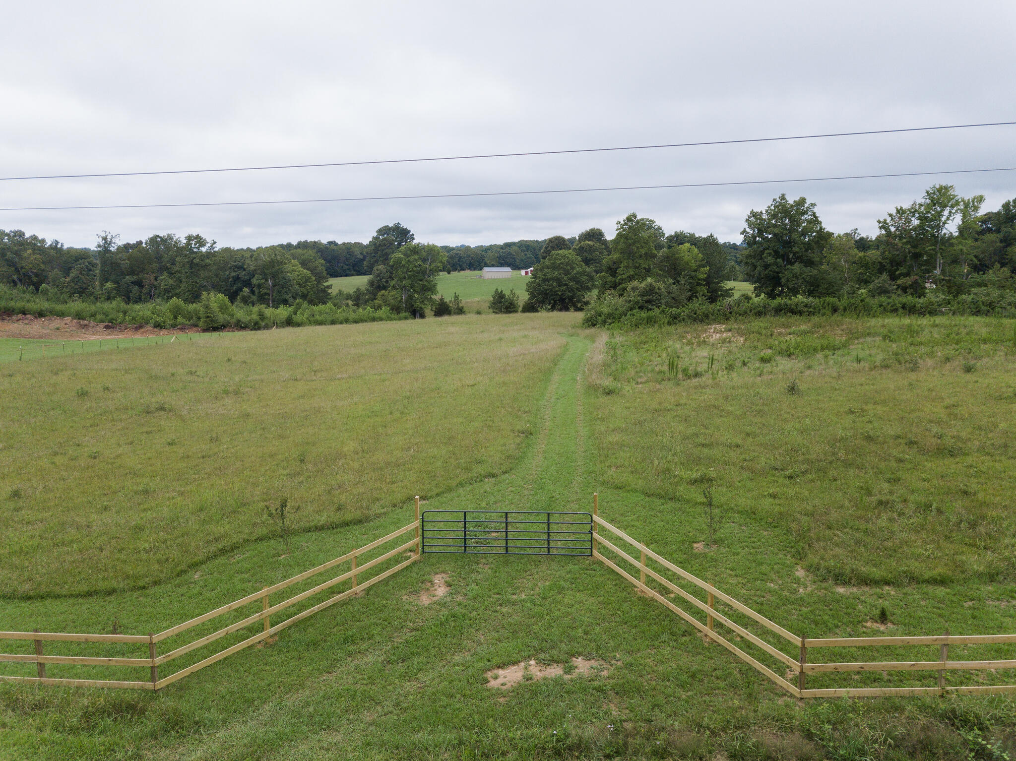 a view of a field with an outdoor space