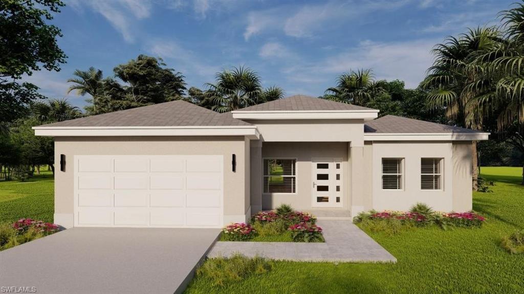 View of front of property with a front yard and a garage