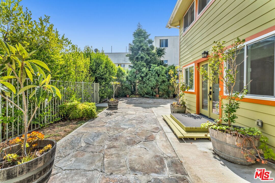 a view of yard with patio